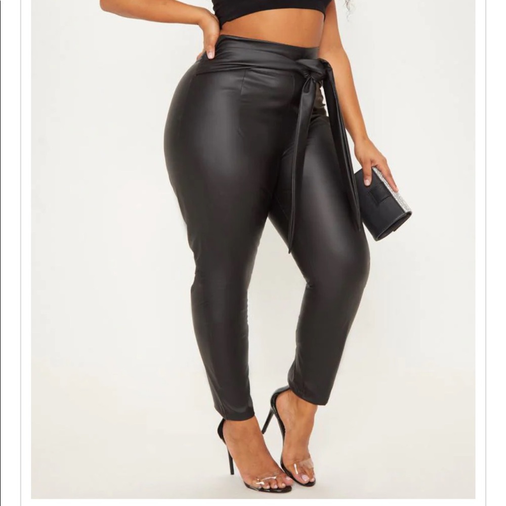 Plus size leather belt trousers.